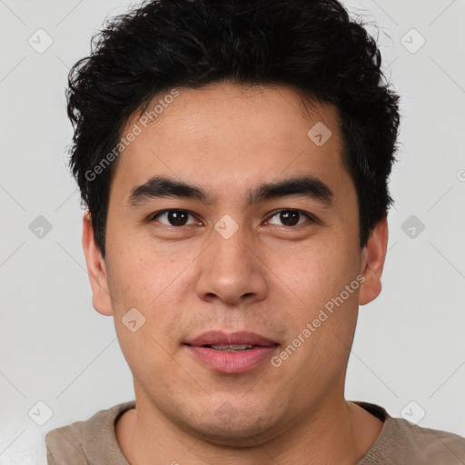 Joyful latino young-adult male with short  brown hair and brown eyes