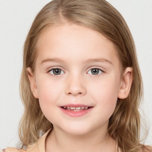 Joyful white child female with medium  brown hair and brown eyes