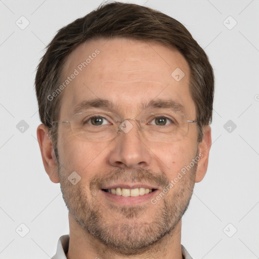 Joyful white adult male with short  brown hair and brown eyes