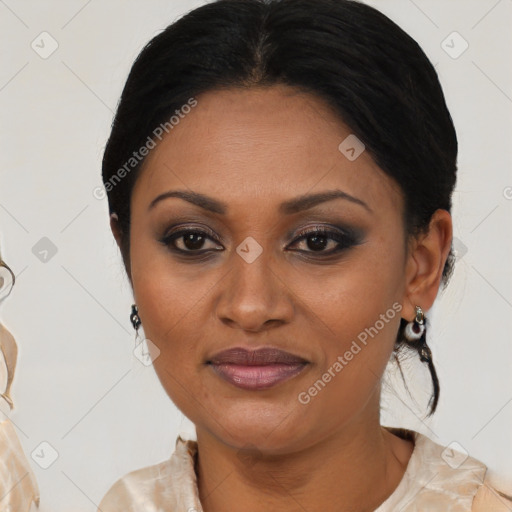 Joyful black adult female with medium  brown hair and brown eyes