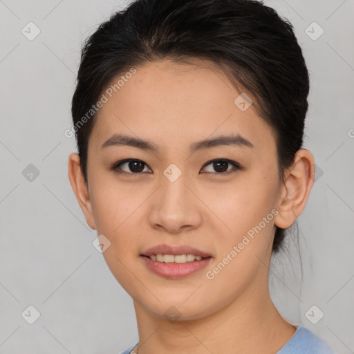 Joyful asian young-adult female with short  brown hair and brown eyes