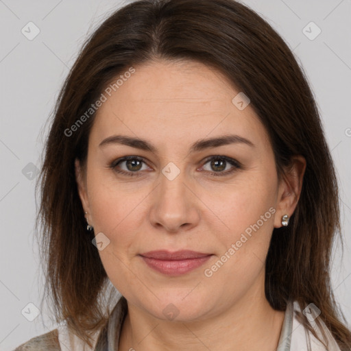 Joyful white adult female with medium  brown hair and brown eyes