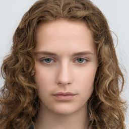 Neutral white young-adult female with long  brown hair and green eyes