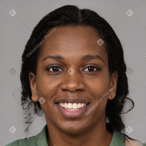 Joyful black young-adult female with medium  brown hair and brown eyes