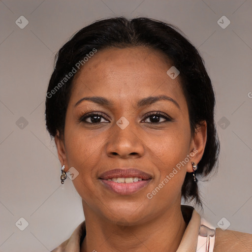 Joyful black adult female with medium  black hair and brown eyes