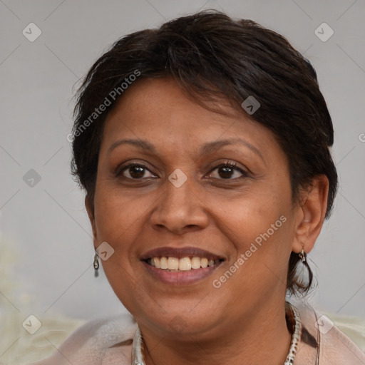 Joyful white adult female with short  brown hair and brown eyes