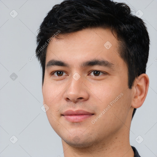 Joyful white young-adult male with short  black hair and brown eyes