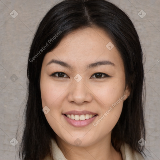 Joyful asian young-adult female with long  brown hair and brown eyes