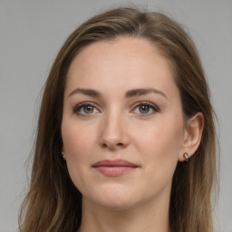 Joyful white young-adult female with long  brown hair and grey eyes