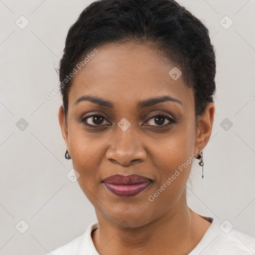 Joyful black young-adult female with short  black hair and brown eyes