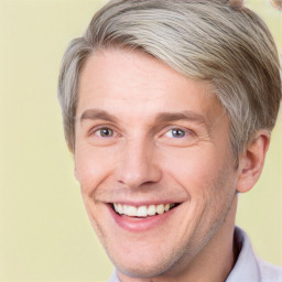 Joyful white adult male with short  brown hair and grey eyes