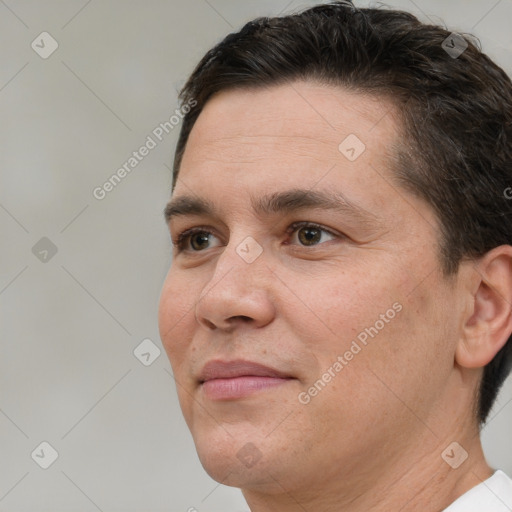 Joyful white adult male with short  brown hair and brown eyes