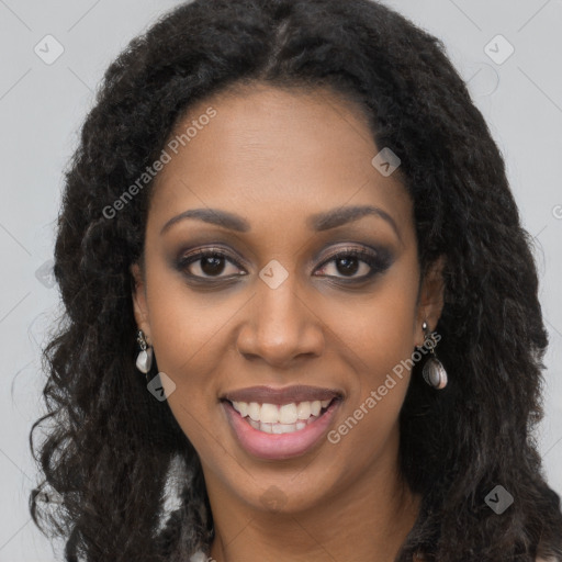 Joyful black young-adult female with long  brown hair and brown eyes