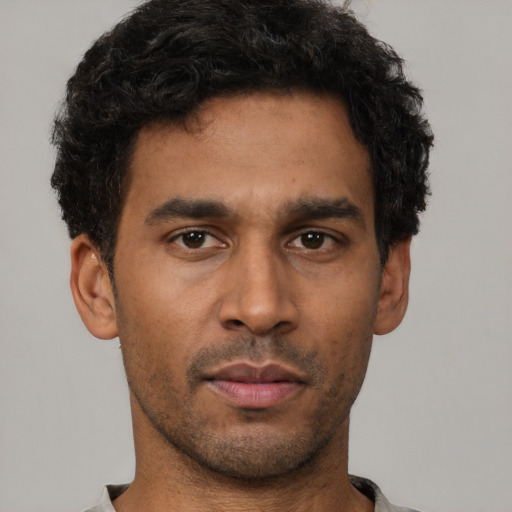 Neutral latino young-adult male with short  brown hair and brown eyes