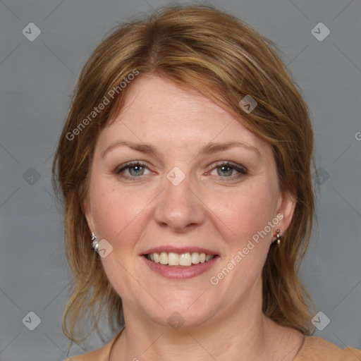 Joyful white adult female with medium  brown hair and grey eyes