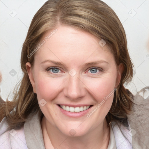 Joyful white young-adult female with medium  brown hair and blue eyes