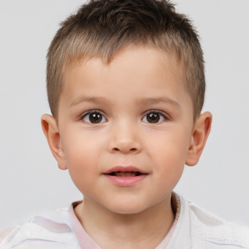 Joyful white child male with short  brown hair and brown eyes