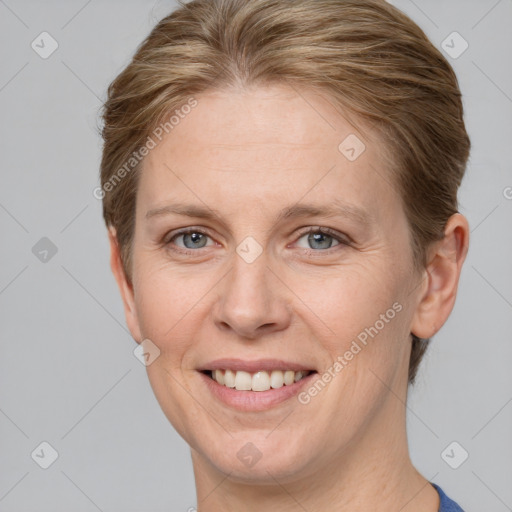 Joyful white adult female with short  brown hair and grey eyes