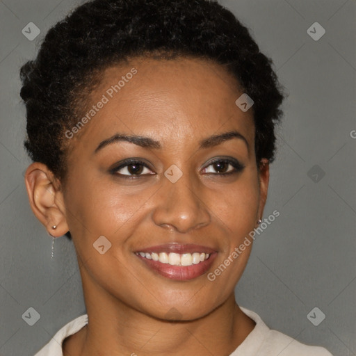 Joyful black young-adult female with short  brown hair and brown eyes