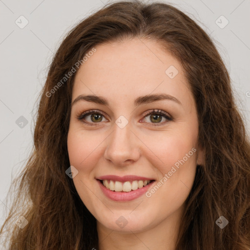 Joyful white young-adult female with long  brown hair and green eyes