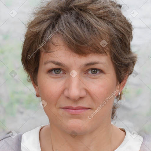 Joyful white adult female with short  brown hair and brown eyes