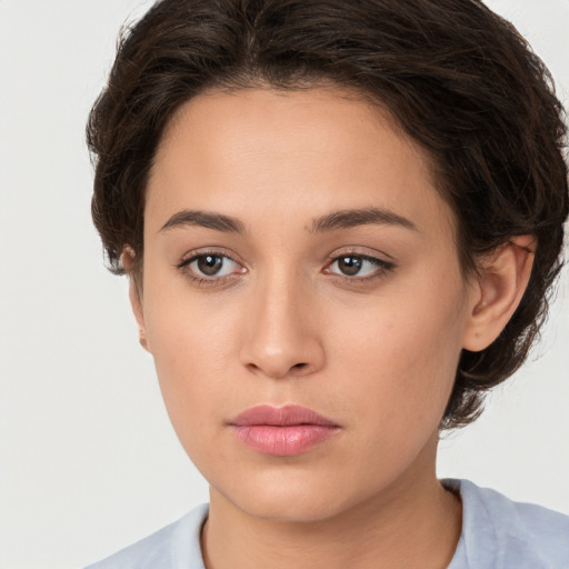 Neutral white young-adult female with short  brown hair and brown eyes