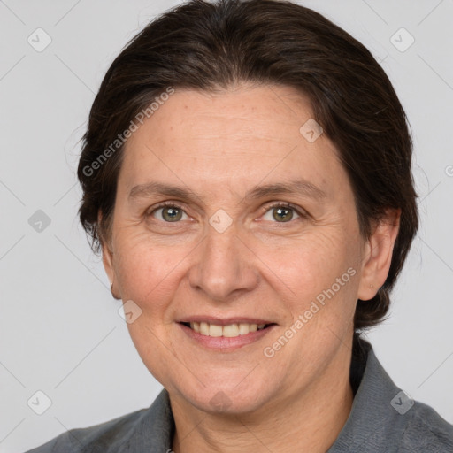 Joyful white adult female with medium  brown hair and grey eyes