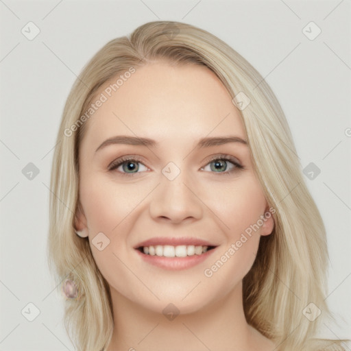 Joyful white young-adult female with long  blond hair and blue eyes