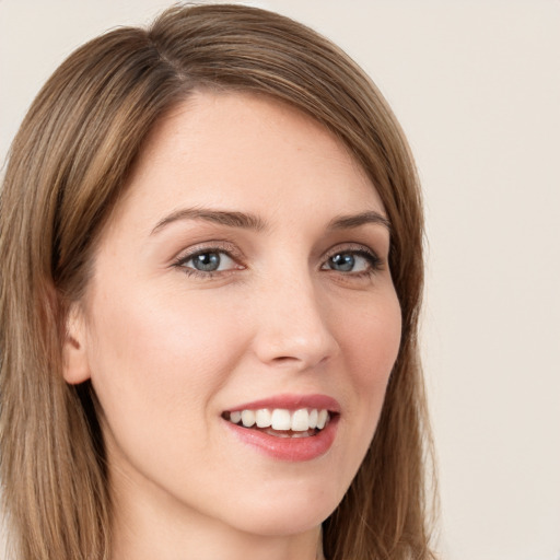 Joyful white young-adult female with long  brown hair and grey eyes