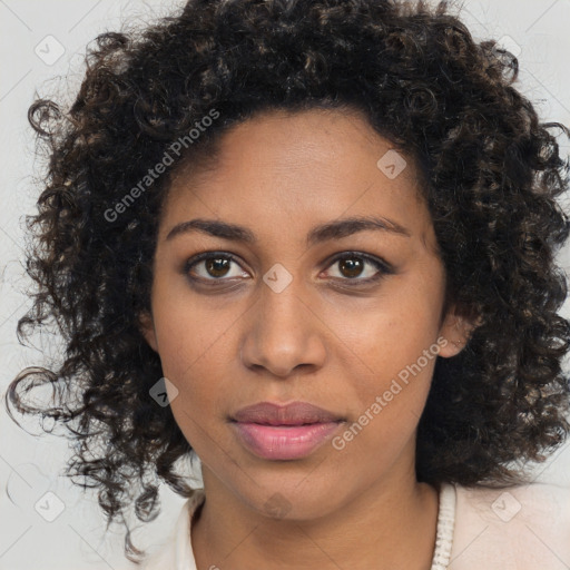 Joyful black young-adult female with medium  brown hair and brown eyes