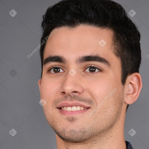 Joyful white young-adult male with short  black hair and brown eyes