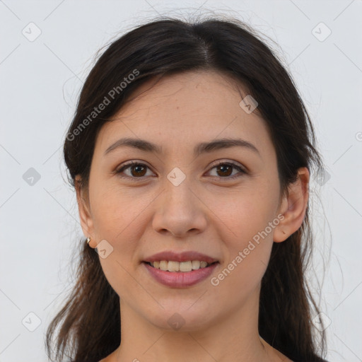 Joyful white young-adult female with long  brown hair and brown eyes