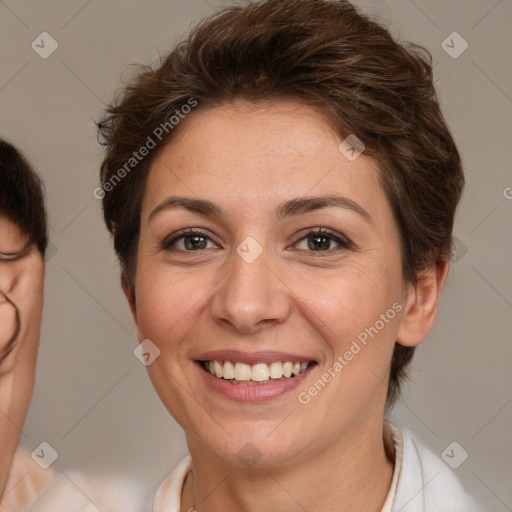 Joyful white adult female with short  brown hair and brown eyes