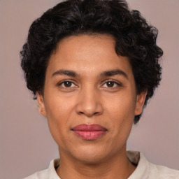 Joyful white adult female with short  brown hair and brown eyes