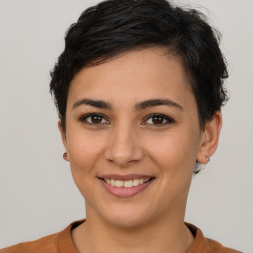 Joyful white young-adult female with short  brown hair and brown eyes