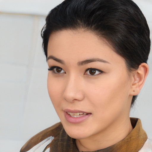 Joyful asian young-adult female with short  brown hair and brown eyes