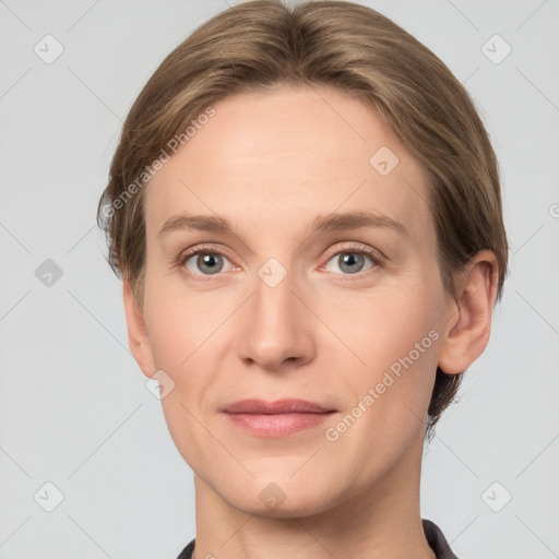 Joyful white young-adult female with short  brown hair and grey eyes