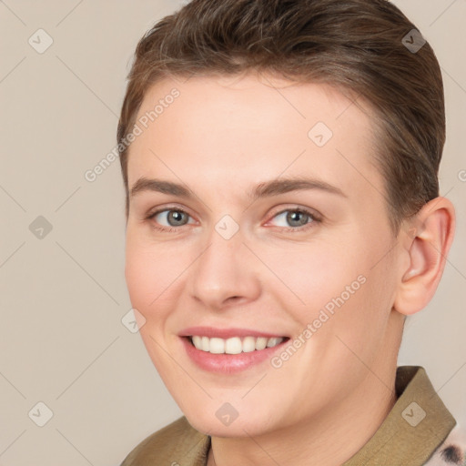 Joyful white young-adult female with short  brown hair and brown eyes