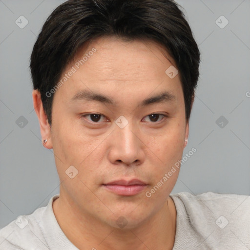 Neutral asian young-adult male with short  brown hair and brown eyes
