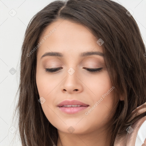 Joyful asian young-adult female with long  brown hair and brown eyes