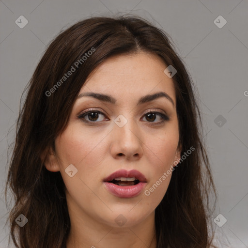 Joyful white young-adult female with long  brown hair and brown eyes