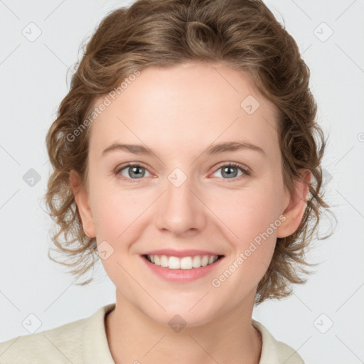 Joyful white young-adult female with medium  brown hair and blue eyes