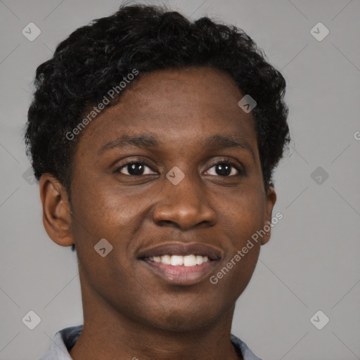 Joyful black young-adult male with short  brown hair and brown eyes