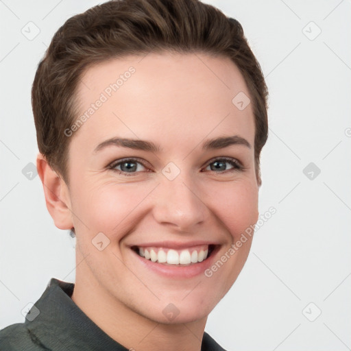 Joyful white young-adult female with short  brown hair and grey eyes