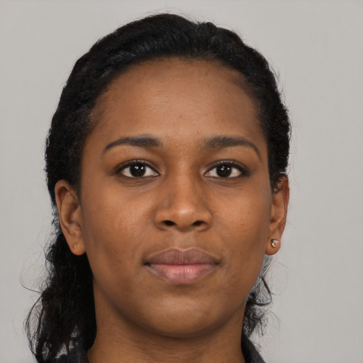 Neutral black young-adult female with long  brown hair and brown eyes