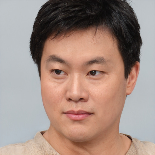 Neutral asian young-adult male with short  brown hair and brown eyes