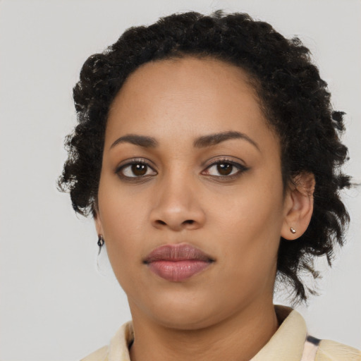Neutral latino young-adult female with long  brown hair and brown eyes