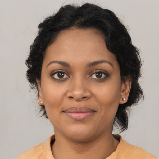 Joyful latino young-adult female with medium  black hair and brown eyes