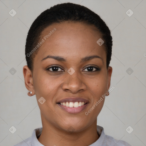 Joyful black young-adult female with short  black hair and brown eyes