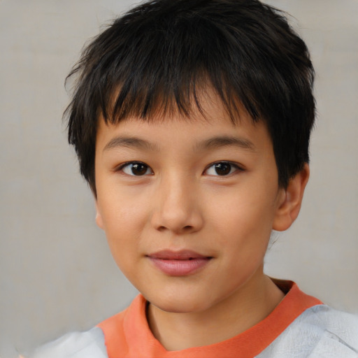 Joyful white child male with short  brown hair and brown eyes